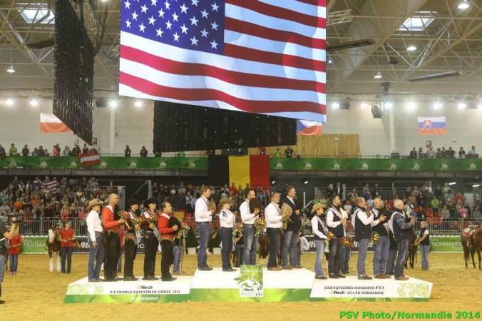 A patriot sight to see the American flag over some cowboys. Photo courtesy Dirk Caremans/FEI